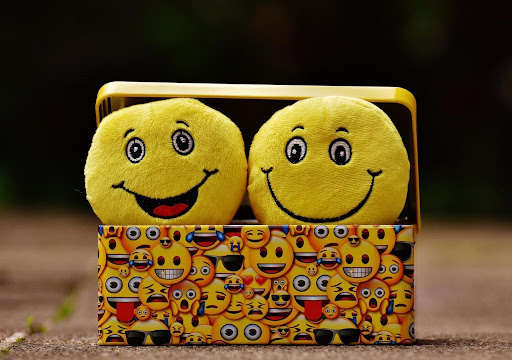 Two Yellow Emoji In A Yellow Emoji Case